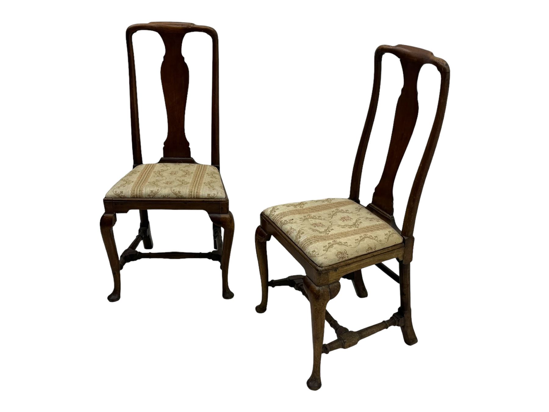 Pair of 19th century Queen Anne design walnut framed side chairs, yoke crest rail over vase-shaped splat, upholstered drop-in seats, raised on cabriole supports with pad feet united by turned stretchers
