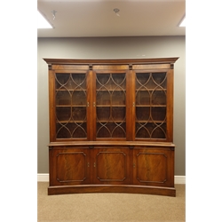  Reprodux Bevan Funnell mahogany concave bookcase on cupboard, three astragal doors above figured cupboards, plinth base, W178cm, H182cm, D45cm  
