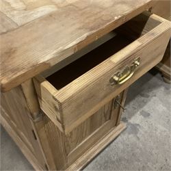 20th century pine twin pedestal desk, rectangular top over three drawers and two cupboards, enclosed by panelled doors, on turned feet - THIS LOT IS TO BE COLLECTED BY APPOINTMENT FROM THE OLD BUFFER DEPOT, MELBOURNE PLACE, SOWERBY, THIRSK, YO7 1QY