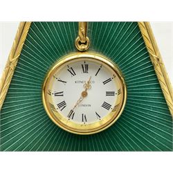 Kitney & Co small desk clock, in green guilloche enamel case of triangular form, decorated with gilt throughout, raised upon two bun feet, H12cm