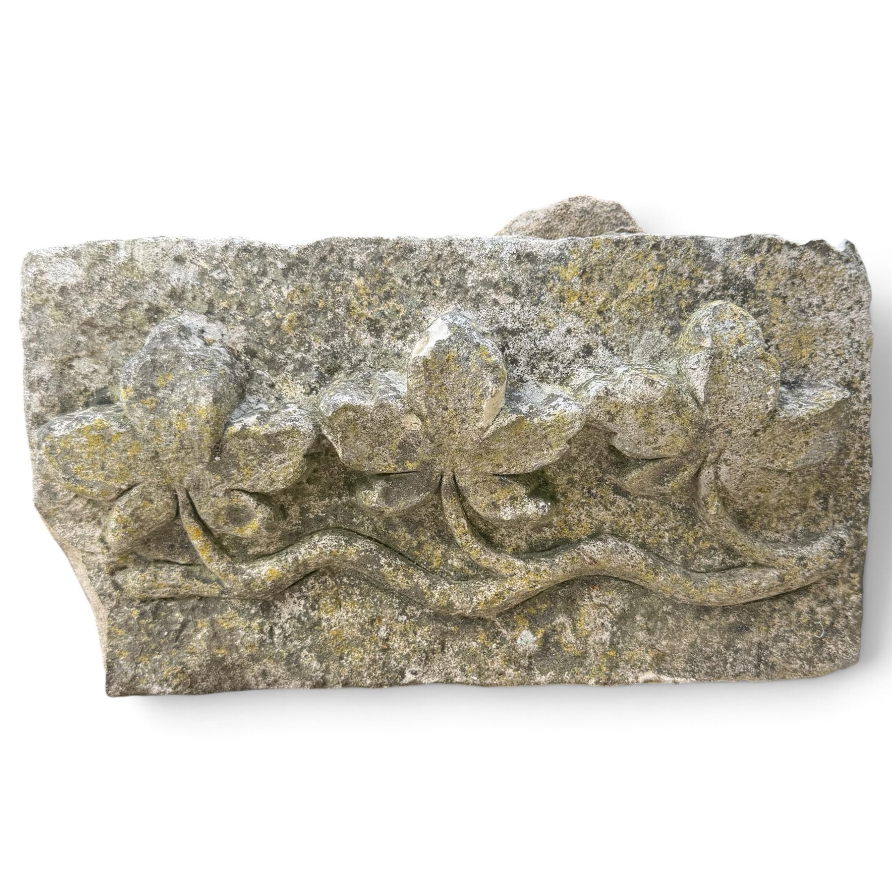 Two 18th century carved sandstone architectural elements, comprising a substantial square pedestal block with recessed panelled facias (W42cm H45cm); and a frieze fragment carved in relief with three stylised flowerheads and an undulating foliate stem (W30cm H18cm)