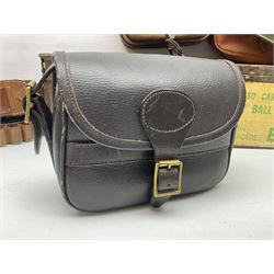 Miscellaneous shooting accessories - W.J. Bowman & Sons clay pigeon launcher; two leather cartridge belts; three cartridge bags; two canvas/leather game bags; and two metal/wooden cartridge boxes