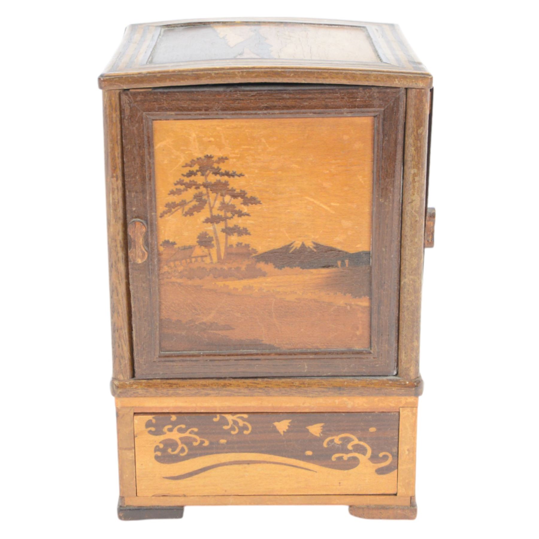 Desktop smokers cabinet, with an inlaid marquetry scene of Mount Fuji, the sides opening to reveal fitted pipe racks, H25cm