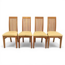 Contemporary teak dining suite comprising extending table and eight chairs, the table with rectangular plank top and one additional leaf extending to 210cm, supported on square tapering legs, the chairs with tall slatted backs and cream upholstered seats