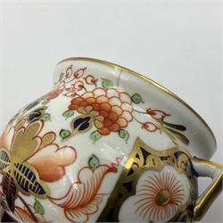 Group of Crown Derby and Royal Crown Derby Imari pattern miniatures, including mid 19th century Stevenson and Hancock cauldron, with painted mark beneath, H5.5cm, a near pair of early Royal Crown Derby scuttles, decorated in the 6299 pattern, each with printed and painted marks beneath including illustration date codes for 1913 and 1922, tallest 6.5cm, and a further early 20th century Royal Crown Derby scuttle, decorated in the 6299 pattern, with printed and painted marks beneath including illustration date code for 1922, H5.5cm, (4)
