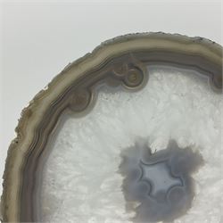 Pair of white agate slices, polished with rough edges raised upon gilt metal stands, H24cm
