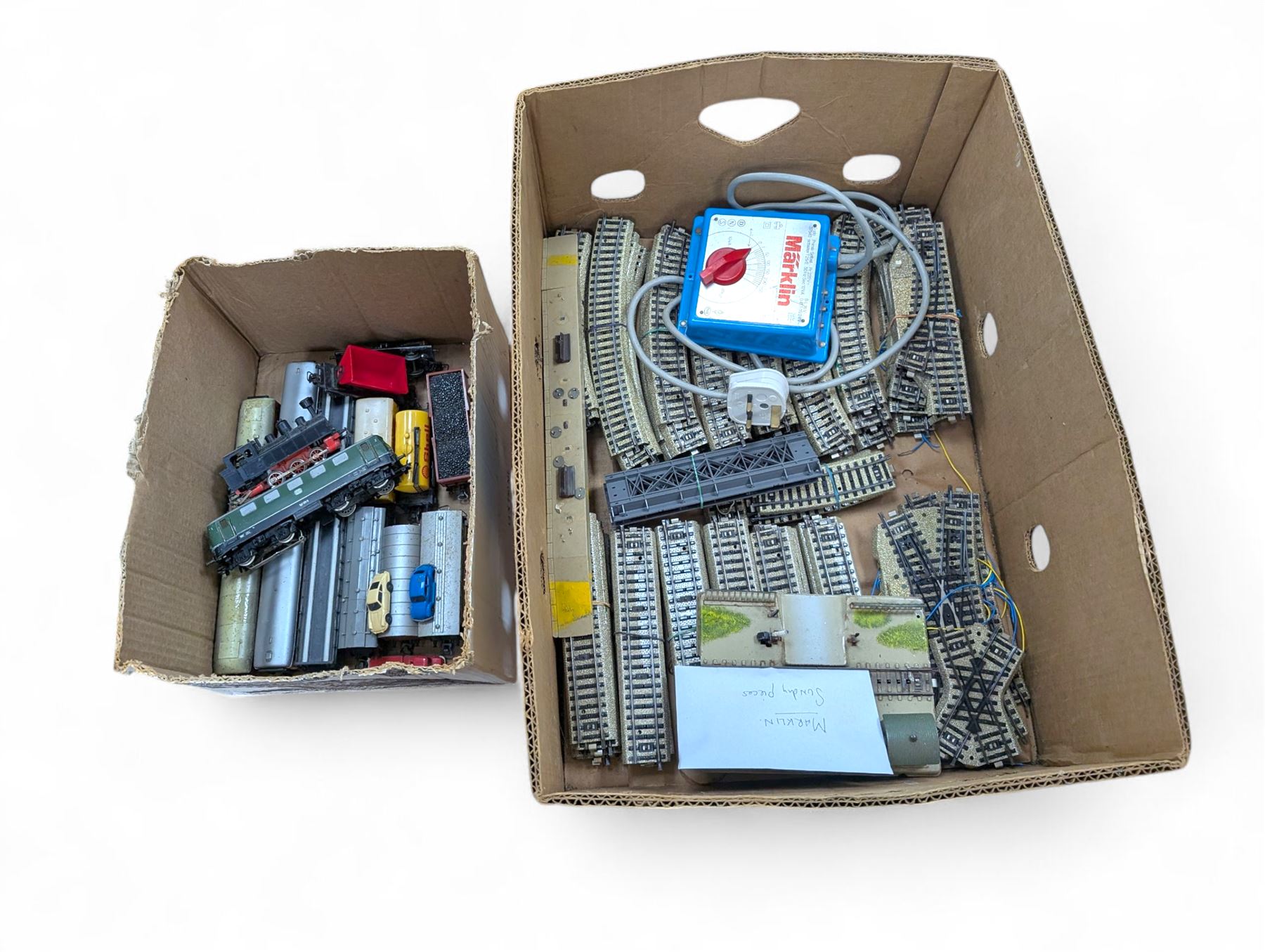 Marklin HO gauge model railway, comprising two Marklin H0 gauge locomotives, including electric DB class example and a steam locomotive, controller, tin plate track and rolling stock