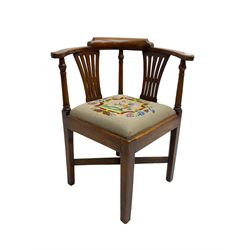 George III elm corner chair, turned supports and pierced splats, with tapestry upholstered drop in seat, square tapering supports joined by x-shaped stretchers