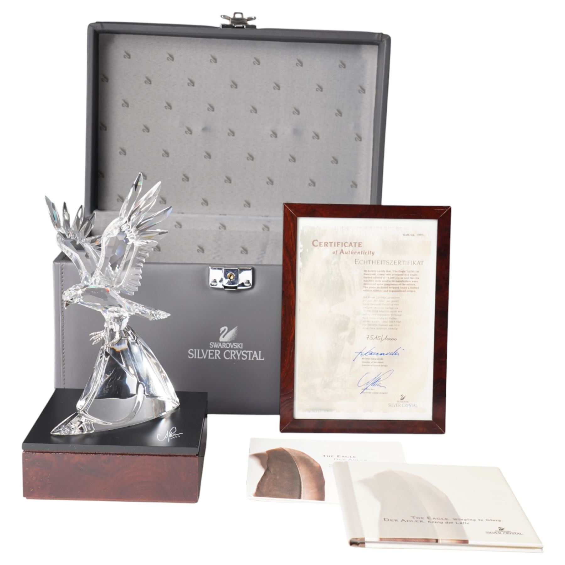 Swarovski, The Eagle, modelled as an eagle in flight upon a wooden base, limited edition 7515/10000, with certificate and case