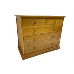 Craftsman made light oak chest, fitted with two short and three long drawers, on plinth base