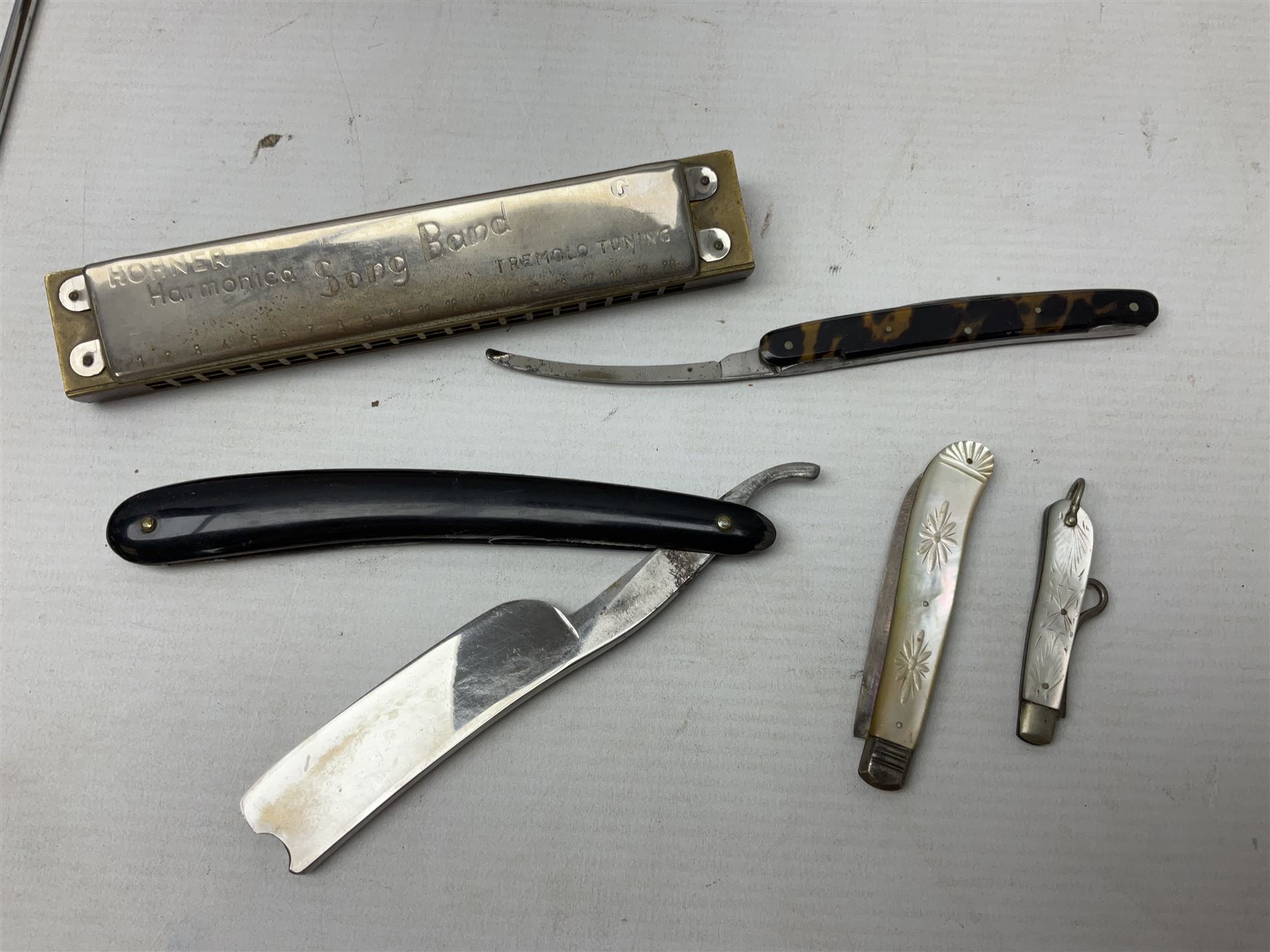 Silver and mother of pearl folding fruit knife together with a similar silver folding button hook, 19th century surgical knife in tortoiseshell cases by Krohne & Sesemann and three Hohner harmonicas, quantity of vintage child's games and toys to include cards, puzzles and misc, Rudyard Kipling, Wood's Illustrated Natural History, Twenty Poems from Rudyard Kipling First published in 1918 Methuen & Co Ltd, London, 1958 Observer cutting etc 