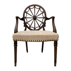 George III mahogany Hepplewhite design elbow chair, oval spider back with carved floral oval cartouche, moulded curved and sweeping arms and supports, upholstered serpentine seat, foliate carved turned and fluted front supports