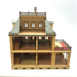  A child's Playmobil Victorian mansion dolls house, together with a good selection of accompanying playmobil characters and furniture.   