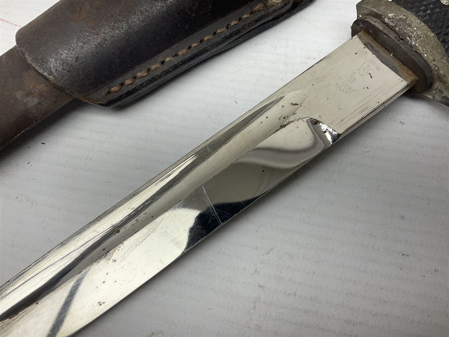 WWII German K98 (short) NCO dress bayonet, the 20cm fullered blade marked Anton Wingen Solingen to the ricasso, with chequered black grip plates; in steel scabbard with indistinctly stamped leather frog |L37cm overall