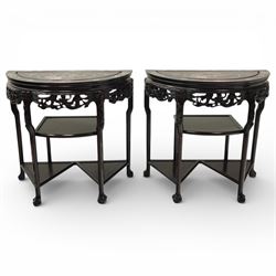 Pair of Chinoiserie hardwood demi-lune tables, the shaped tops inlaid with mother-of-pearl...