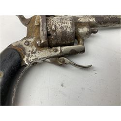 19th century 7mm six-shot pin-fire revolver, with folding trigger, two-piece ebonised grip and ejector rod in butt L17cm