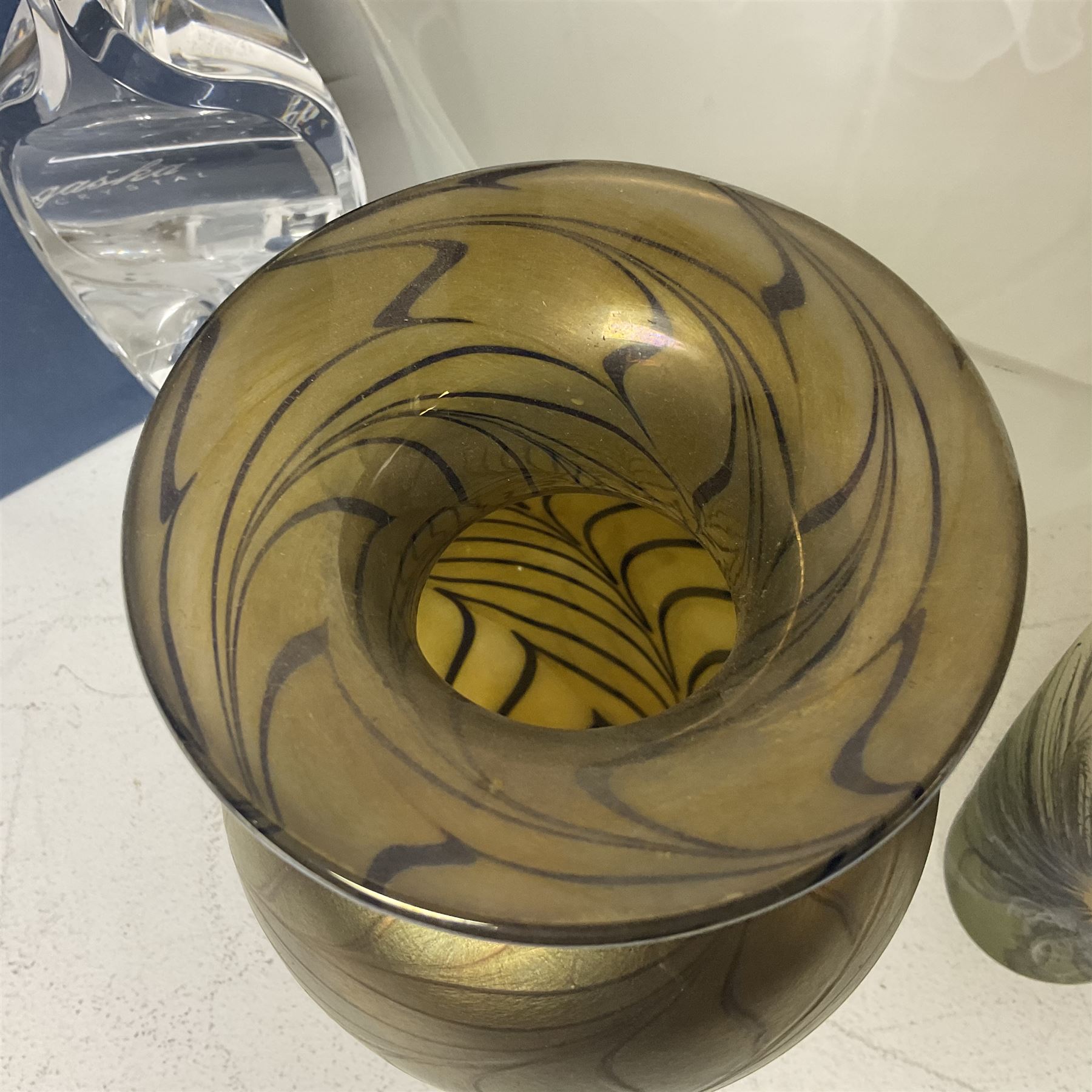 Late 20th century art glass, to include a Robert Held vase, of baluster form with iridescent swirl design, two frosted glass vases with peacock feather design on green and white ground, frosted glass tulip shaped bowl with smoke design and a Rogaska Crystal cobra candlestick, tallest vase 27cm