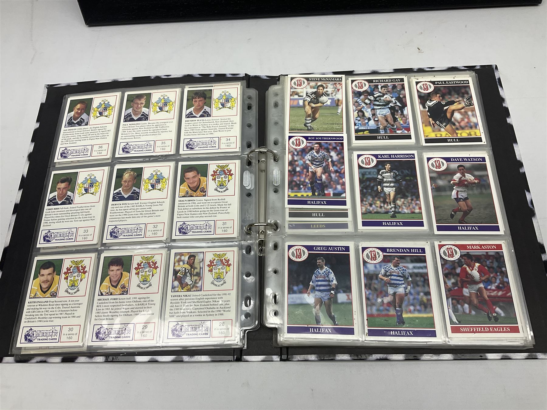 Hull F.C. memorabilia; Clive Sullivan 1986 memorial game programme, Open Evening 1994 programme with multiple player signatures, 'Old Faithful' 45rpm record, Wembley rosettes, 2000 team poster with facsimile signatures, framed print 'Farewell to the Boulevard 1895-2002', fully signed team photograph, various booklets, CD, DVD etc; and a folder containing the Merlin Rugby League card collection