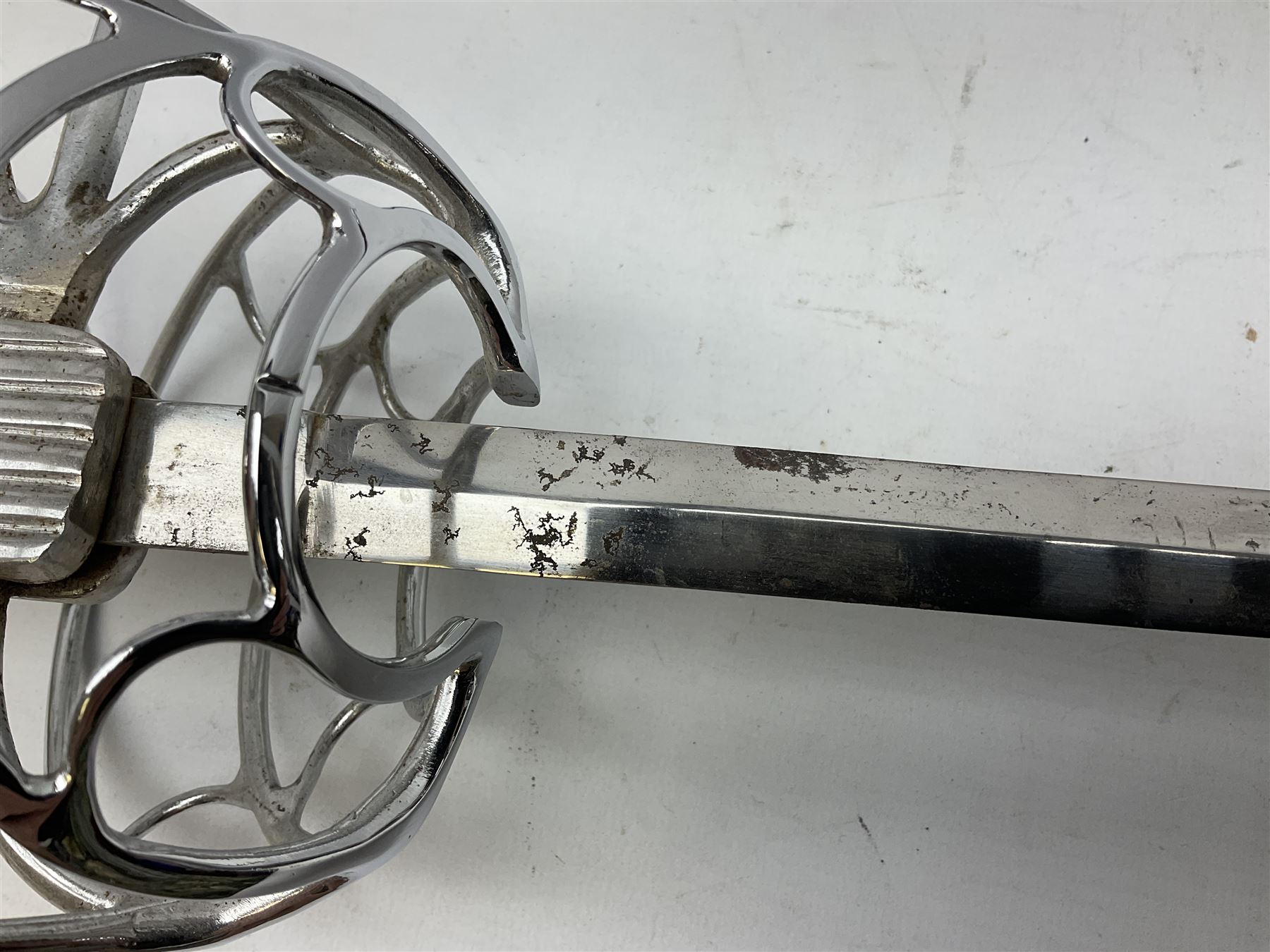 Replica knight's longsword, the 91.5cm double-edged steel blade with basket hilt and wire-bound bone grip with spherical pommel, in leather scabbard L112cm overall