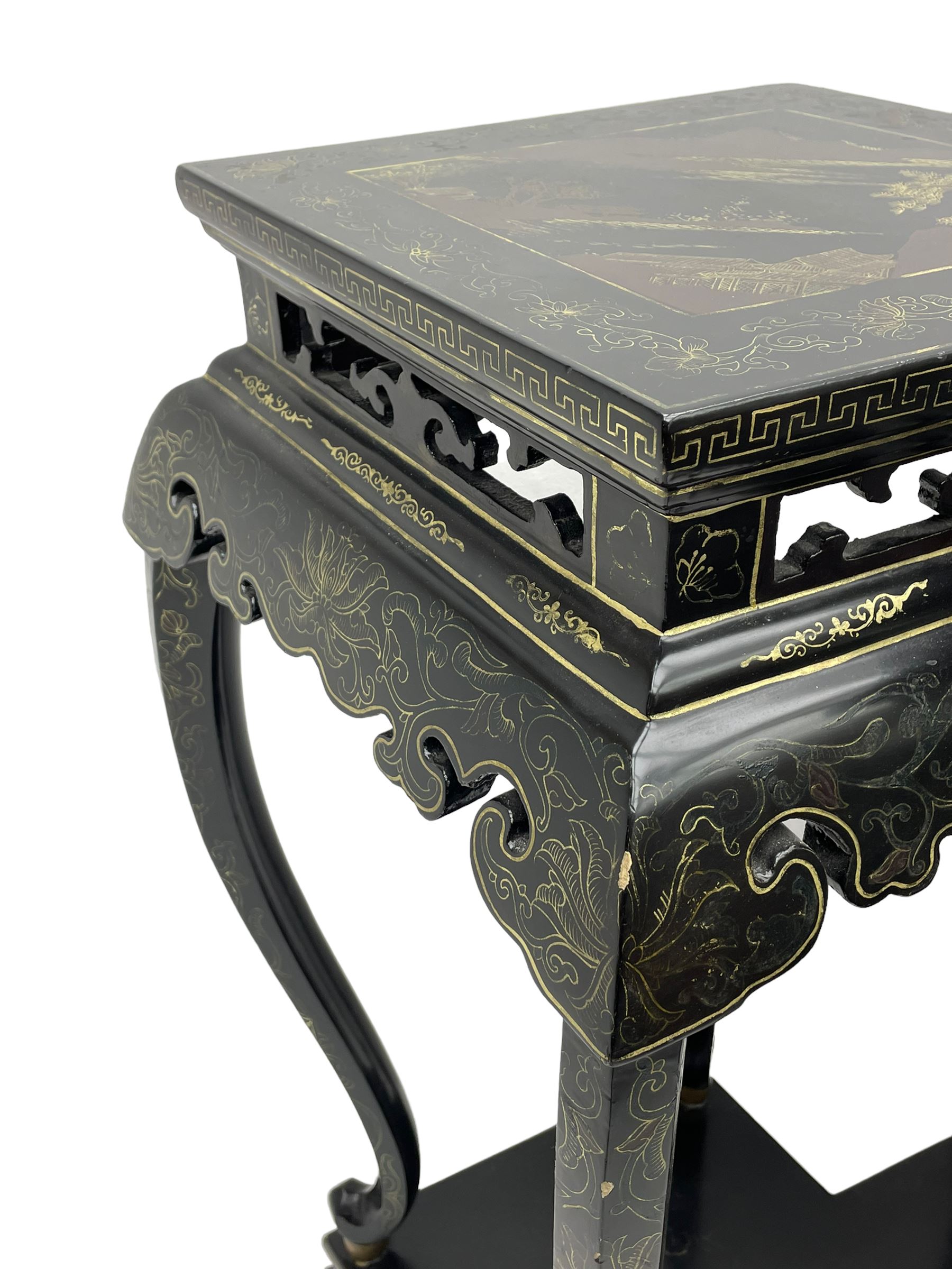 Chinese black lacquer double jardinière stand, the double-lozenge top painted with traditional landscape scenes within a gilt strung border, the pierced frieze with trailing foliate decoration and geometric patterns over the shaped projecting apron, supported on six cabriole supports united by a hexagonal undertier, raised on compressed spade feet