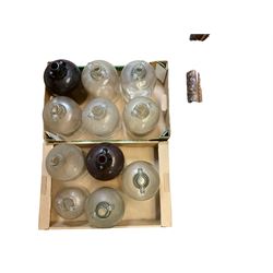 Eleven glass demijohns, including two brown glass examples