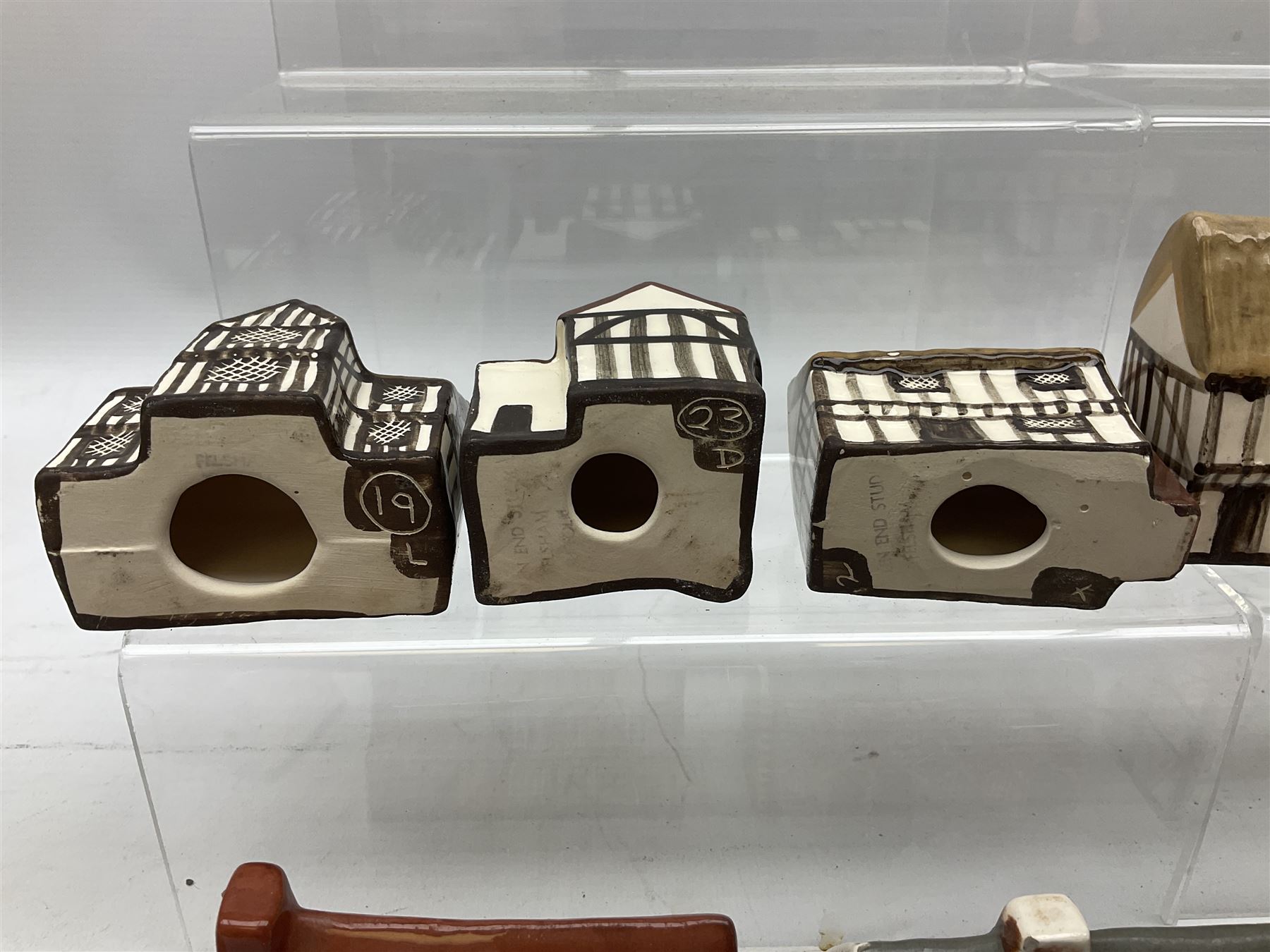 Twenty studio pottery figures of houses and cottages, comprising seventeen Mudlen End Studio Felsham Suffolk examples and two John Putman's Heritage Houses examples