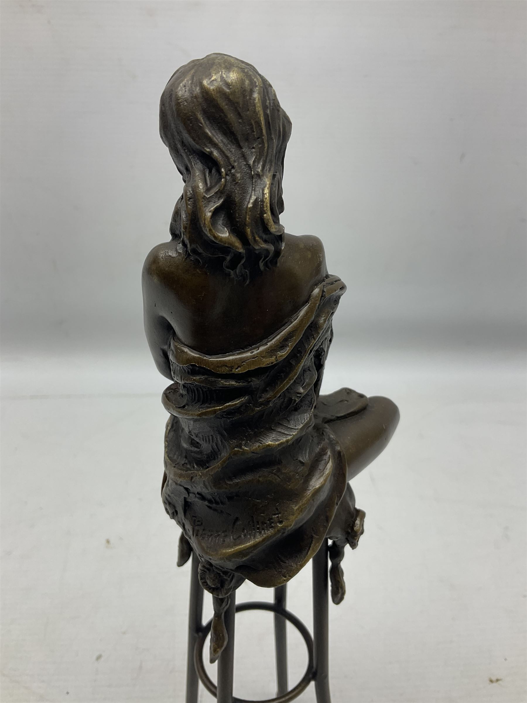 Art Deco style bronze modelled as a female figure seated upon a chair holding an apple, after 'Pierre Collinet', H28cm