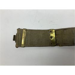 WW2 British black felt beret with Pioneer Corps cap badge, with Kangol Wear maker's mark dated 1943; and a British Army green webbing belt (2)