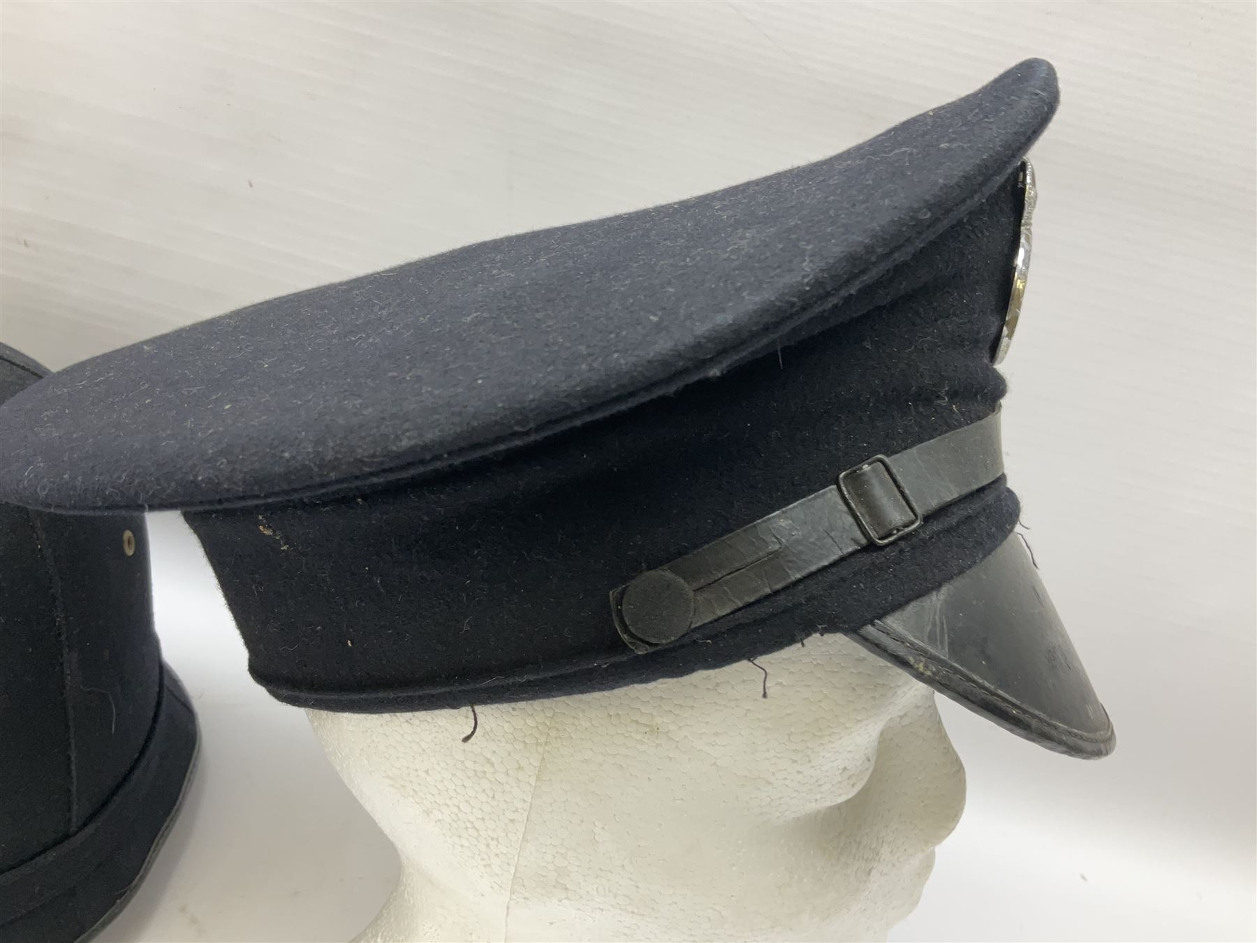 Hull City Police - helmet with king's crown night plate; two further ball-top helmets with Queen's crown plates; and a peaked cap (4)