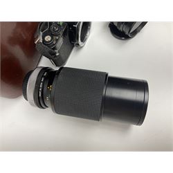 Four Minolta camera bodies, to include Dynax 500si, serial no. 94812651 with 'Signa Zoom 1;3.5-4.5 f=28-70mm' lens, Maxxum 300si, serial no. 97821665, with 'Tamron AF 80-210mm' lens and Dynax 300si, serial no 01603265'  with Minolta AF Power Zoom 35-80mm 1;4' lens, etc, together with Pantax MV1 camera bodies and other camera equipment 