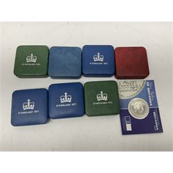 Seven The Royal Mint United Kingdom sterling silver proof crown coins, comprising two 1972, three 1977, 1981 and 1993, all cased with certificates and a Queen Elizabeth II 2001 one ounce fine silver Britannia coin on card (8)