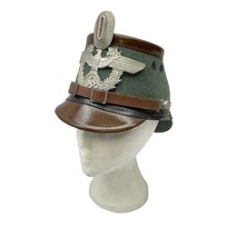 WW2 German rural police shako with helmet plate and liner; bears label 'Hans Romer Echt Fiber-Tschako Neu-Ulm (Donau)'