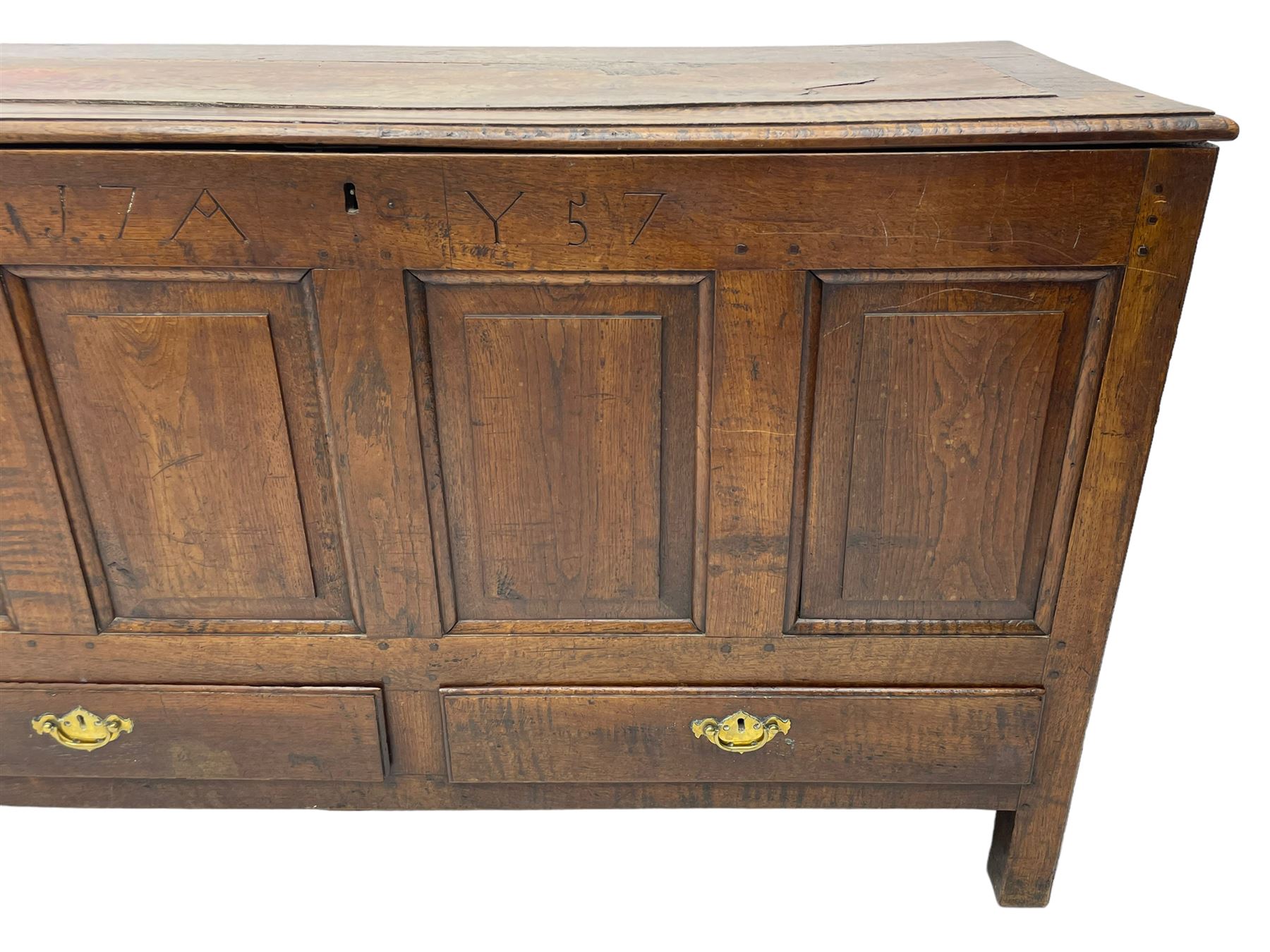 Georgian oak mule chest, moulded rectangular hinged lid over quadruple fielded panel front, the frieze inscribed '17 A Y 57', fitted with two drawers, panelled ends and back, on stile supports