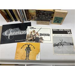 Sixteen books/booklets on guns and shooting including 1969 Holland & Holland Catalogue; two Gunmark Guides to Good Shooting; Shooters Bible 1972 etc; and small quantity of militaria books