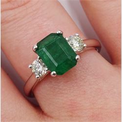 18ct white gold emerald and diamond three stone ring, hallmarked, emerald 1.16 carat, total diamond weight 0.39 carat, with World Gemological Institute Certificate 
