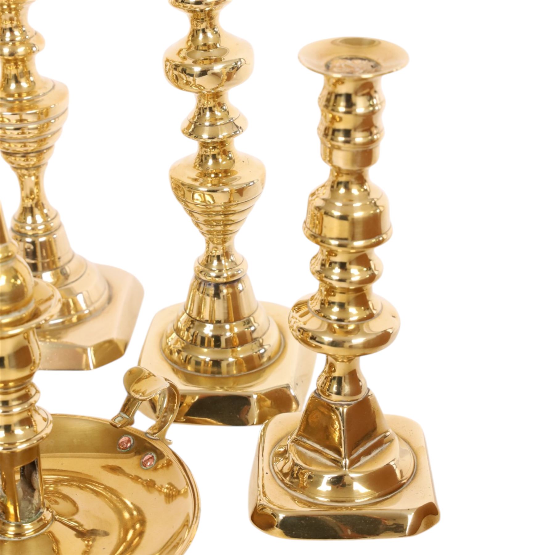 Pair of 19th century brass chamber candlesticks with detachable snuffers, together with three pairs of brass candlesticks 