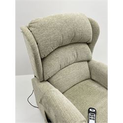 Electric rise and recline armchair upholstered in a light green fabric 