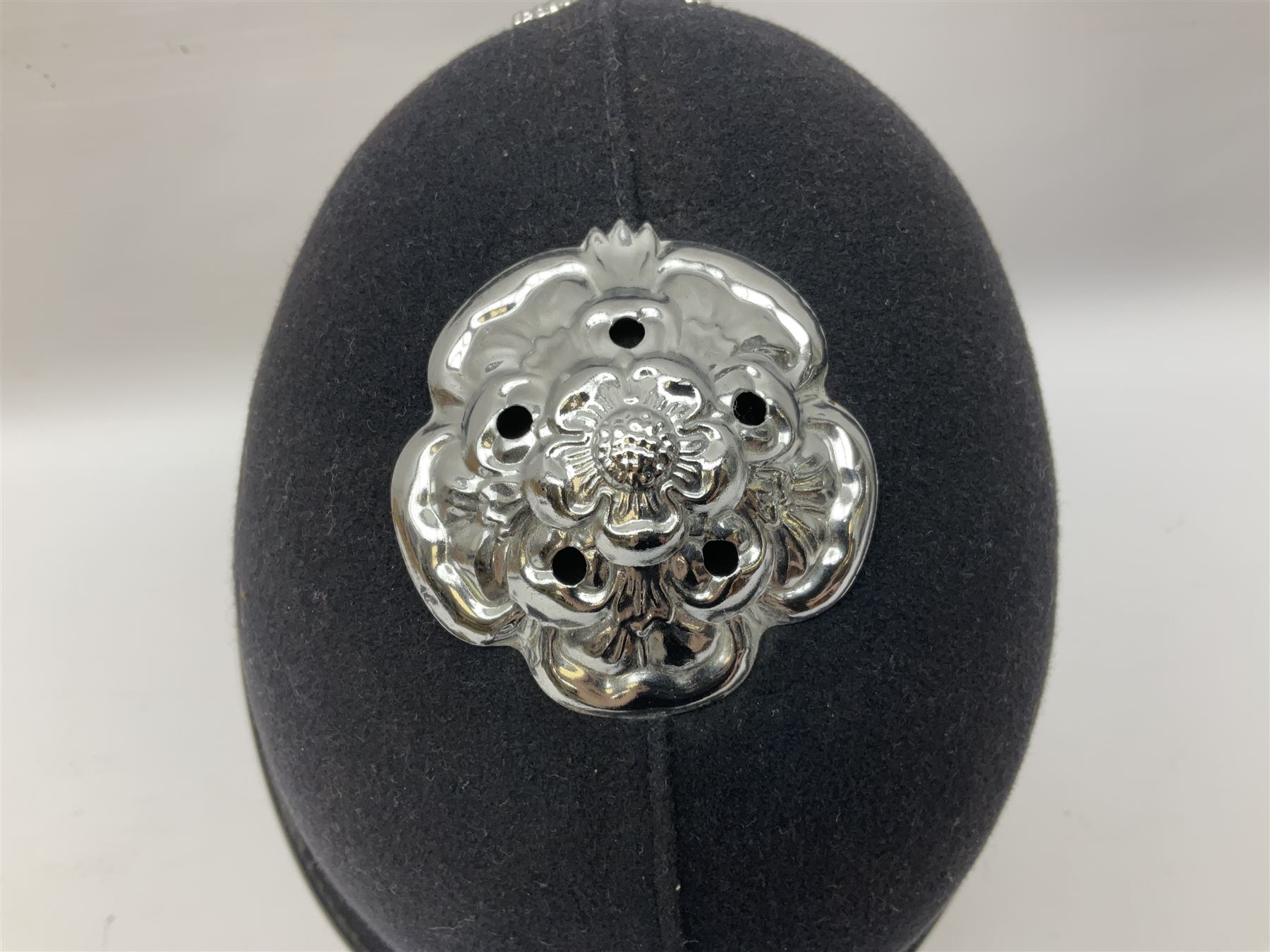 British Transport Police Custodian helmet with Queen's Crown plate; Hiatt & Co ebonised hardwood patrol truncheon; and pair of Hiatts 1960 hand-cuffs (3)