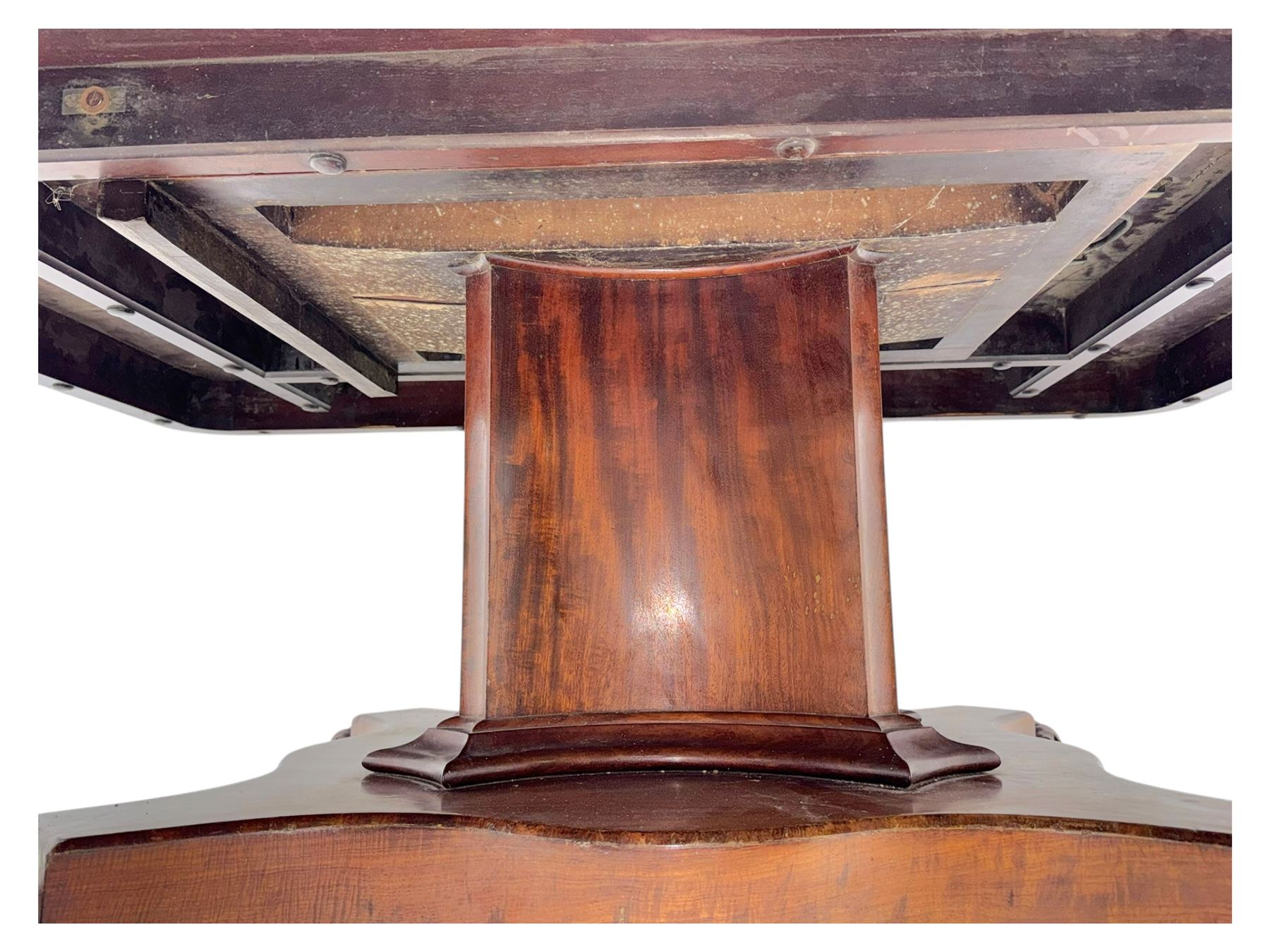 Victorian mahogany tilt-top table dining table, rounded tilt rectangular top with moulded edge, on octagonal column, raised on shaped quadriform base with bold scrolled feet