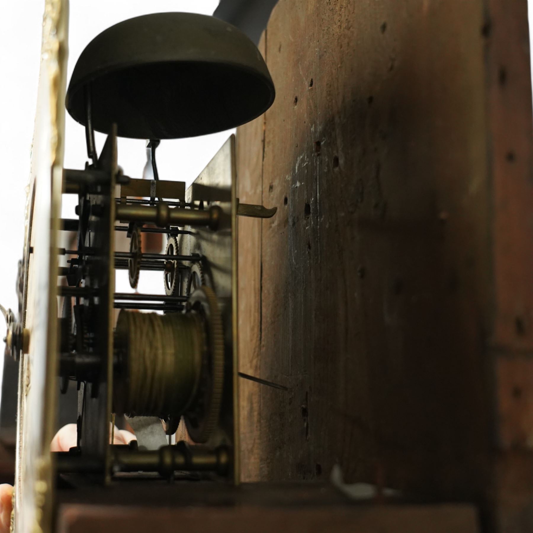 William Vise of Wisbech (Cambridgeshire)-8-day mahogany Longcase clock c1750, with a swan neck pediment and inlaid parterre, break arch hood door beneath flanked by detached reeded pilasters with brass capitals, trunk with conforming pilasters to the corners and an inlaid door with banding to the edge and oval satinwood inlay and matching conche inlay to the centre, conforming pediment with matching circular inlay and raised on bracket feet, brass break arch dial with interesting scroll and floral spandrels to the arch and four season spandrels to the corners, fully engraved dial centre with steel hands, engraved seconds dial and square date aperture, silvered boss to the arch with makers name and conforming chapter with Roman numerals, five minute Arabic's and minute track, dial pinned directly to a two train weight driven rack striking movement, sounding the hours on a bell. With weights and pendulum. 
Both a William and John Vise are recorded as working in Wisbech between 1740 and1758.
