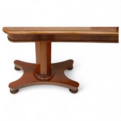 William IV mahogany reading table, the rectangular top with rounded corners and moulded edge, one end fitted with two hinged adjustable reading slops with two rests, the sliding top with a sprung stay mechanism, supported on a single tapered faceted column  with turned collar on a quatreform base with compressed bun feet