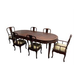 Mid to late 20th century Chinese hardwood extending dining table, two additional leaves, shaped apron carved with foliate scrolls, leaf carved cabriole supports (W246cm, H78cm, D117cm), and set six (4+2) dining chairs with shaped cresting rails over carved splats