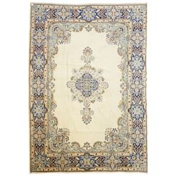 South East Persian Kirman hand-knotted carpet, ivory field with central floral medallion i...