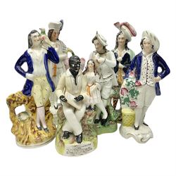 19th century and later Staffordshire pottery figures, to include Highlanders, Uncle Tom and Eva, figure with a bird etc