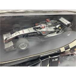 Three Minichamps 1:18 scale die-cast McLaren racing cars - Mercedes MP4-19 D. Coulthard; Mercedes MP4-20 K. Raikkonen; and Vodaphone Mercedes MP4-22 L. Hamilton 2007; all boxed (3)

