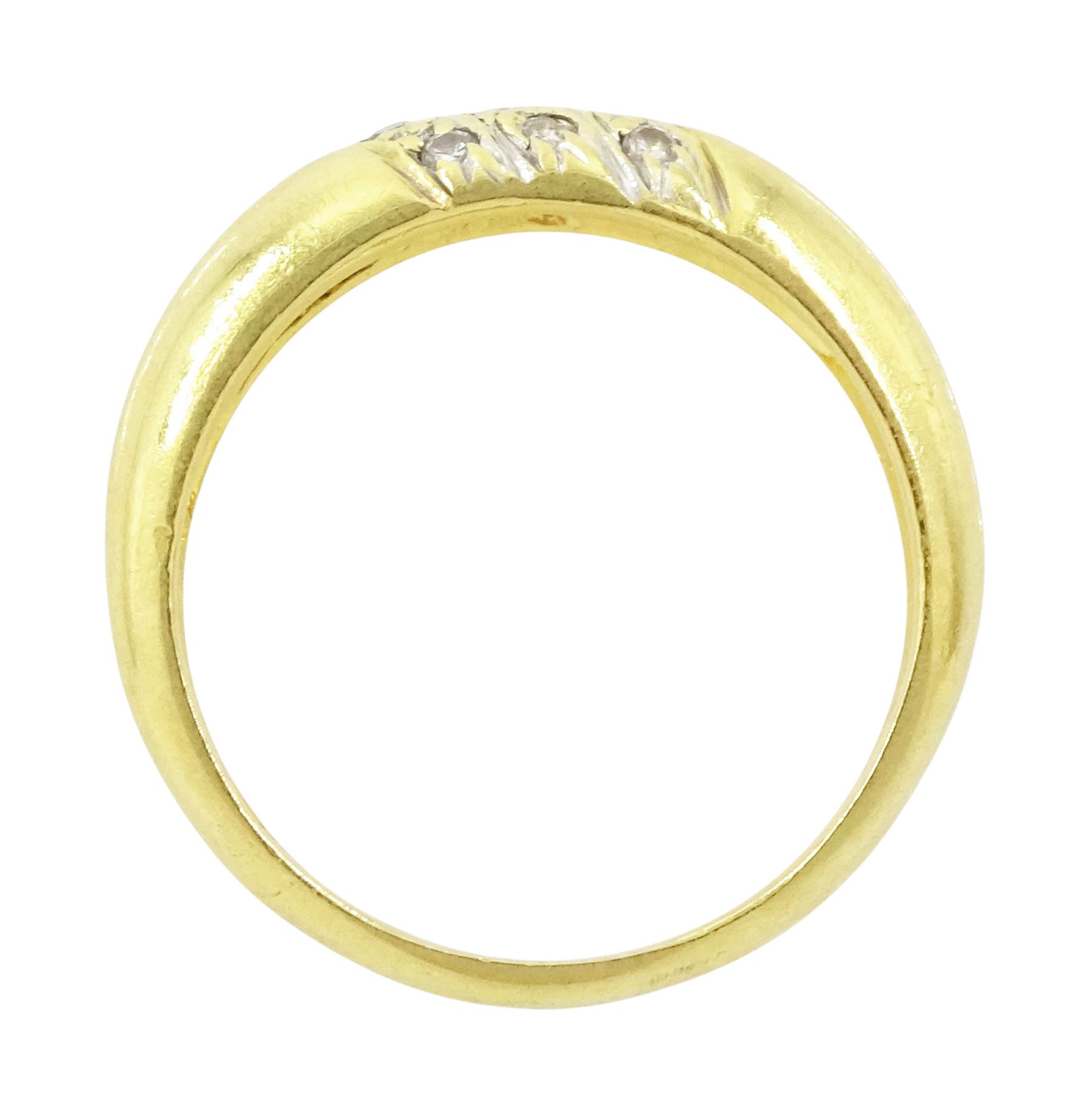 Gold diamond ring, rubover set with nine round brilliant cut diamonds