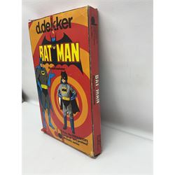 Two Boxed Batman Playsuit Costumes - 1960s 20th Century Original Play Suit, black eye mask, plastic vinyl cape/gauntlets, leather style belt, blue/yellow shirt, with Bat motif and blue/yellow pants; in original illustrated lidded box; and 1976 Decker Batman Playsuit costume, vinyl cape/ mask/gloves/boot tops/yellow belt, grey cloth top and pants; in original illustrated box (2)