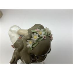 Three Lladro figures, comprising, Dreams of Summer Past no 6401, Spring Breeze no 4936 and Breezy Afternoon 5682 together with Lladro plaque Art Brings us Together no 7677, all in original boxes, largest example H35cm