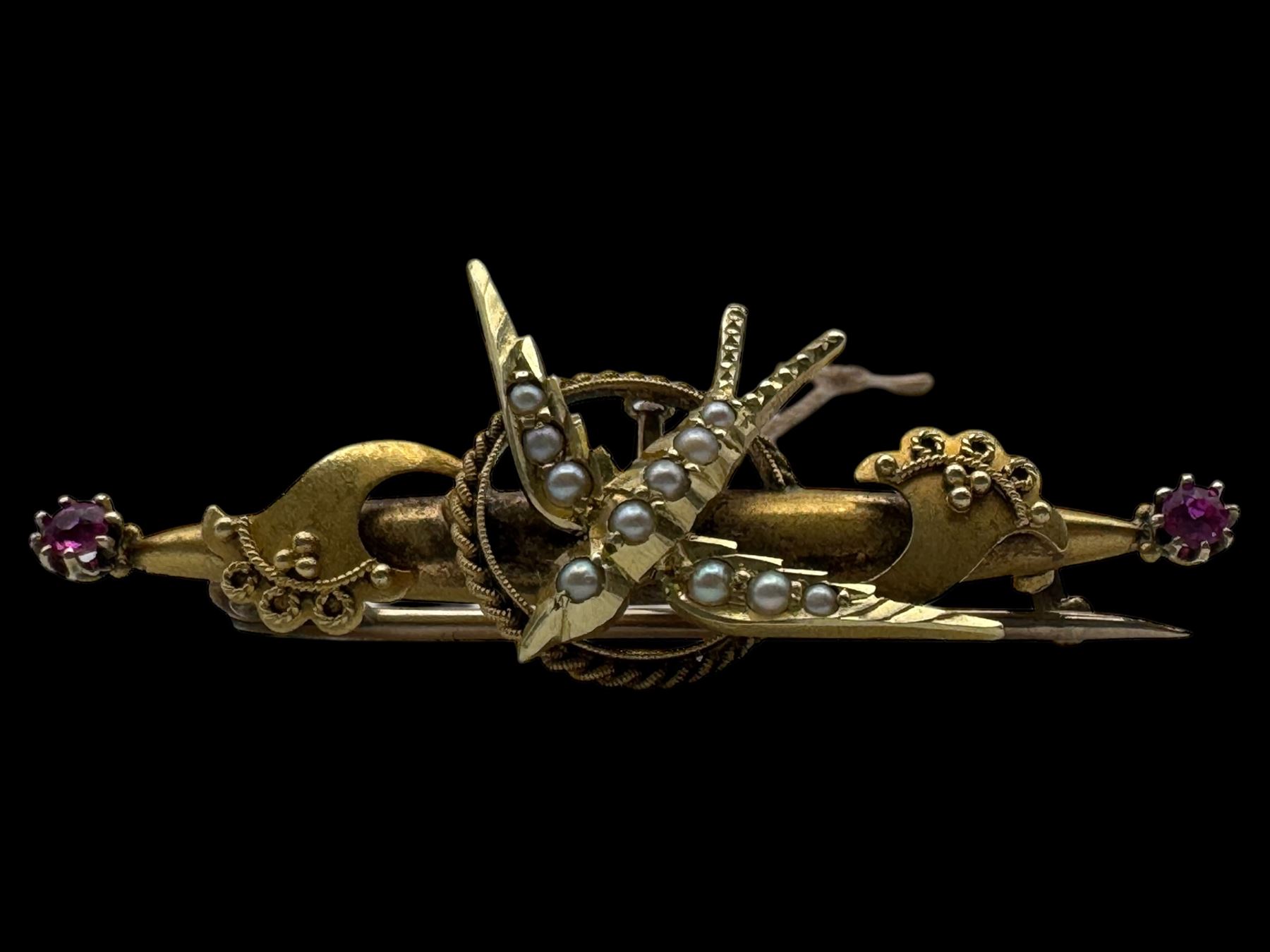 15ct gold swallow brooch, 9ct gold stone set cluster ring and a silver locket pendant, all hallmarked 