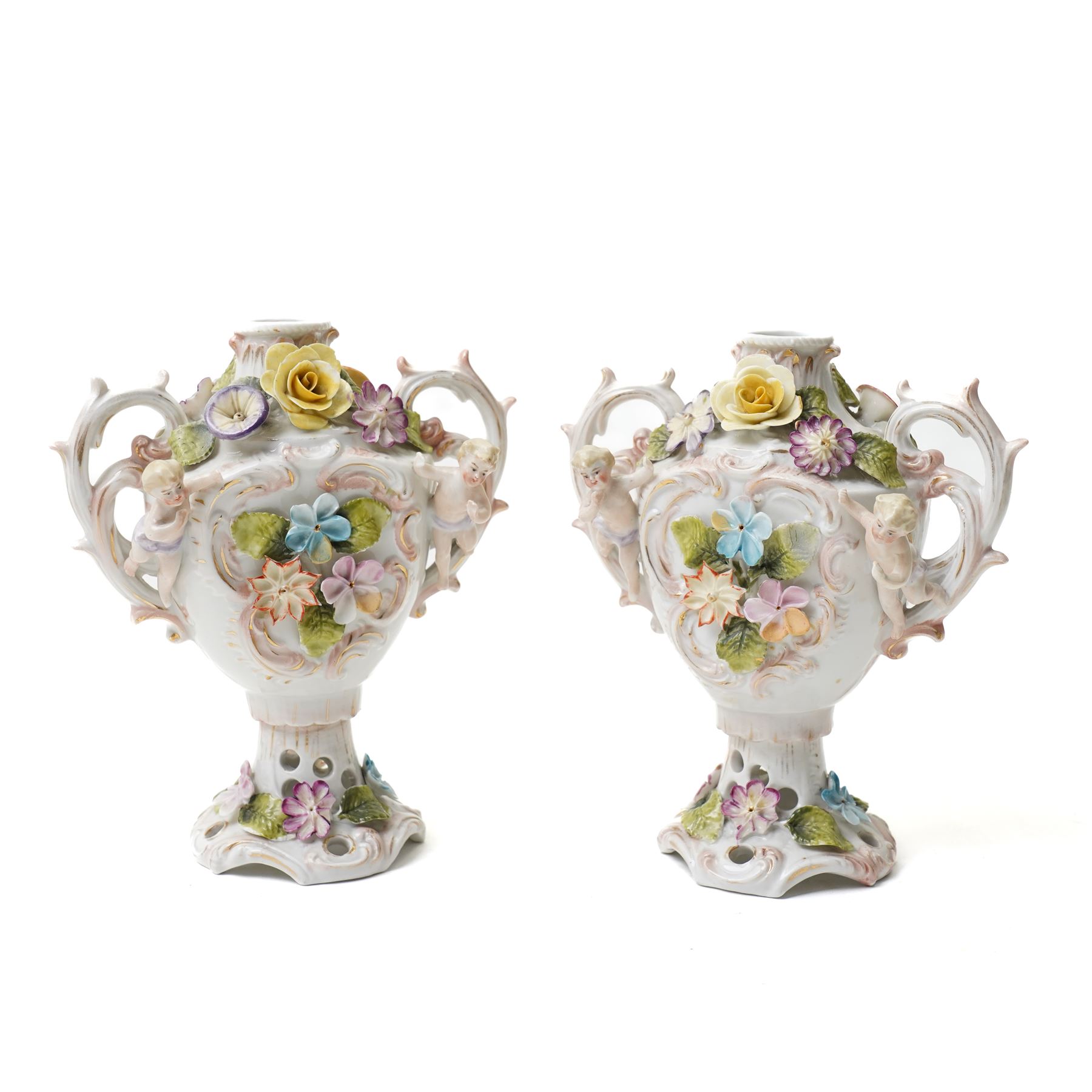 Collection of German and continental porcelain figures, including a figure of Juno with peacock, two figures feeding birds on benches, cherub candlesticks, and others